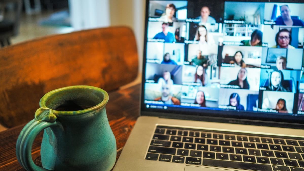 featured Freelancer on a laptop video call using a headset for a live voice AI intake