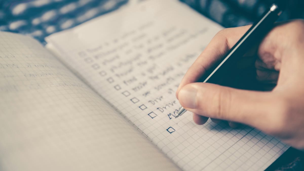 featured Open notebook and laptop on a desk for building reusable freelancing AI skills