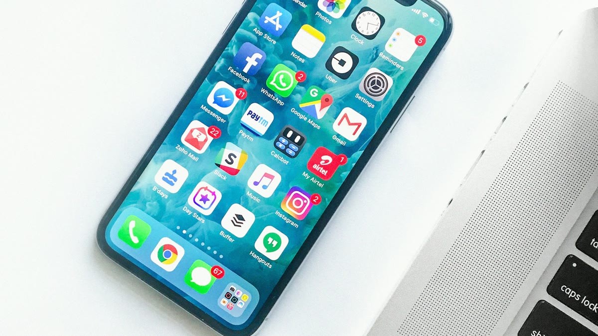 featured Person holding a modern smartphone that represents new on-device AI flagship chips