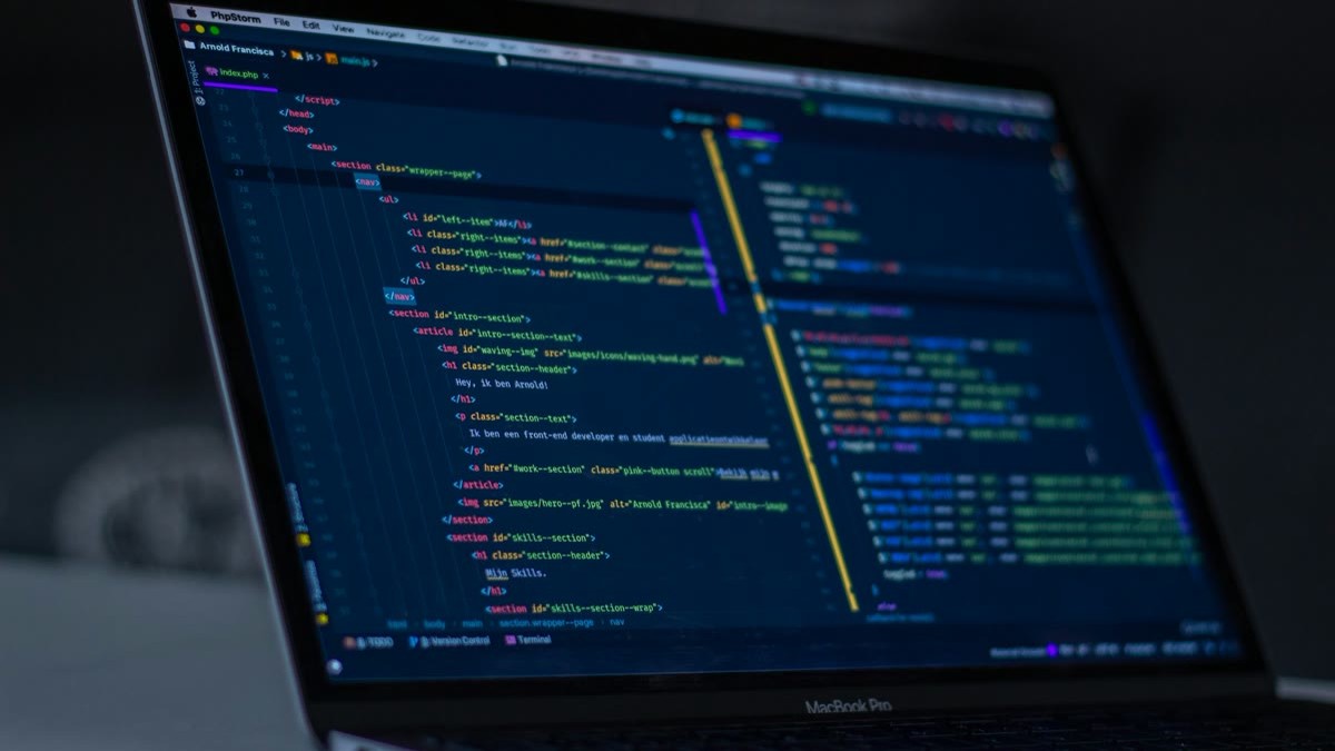 featured Laptop screen showing code in a dark editor for a multi-file freelance software project
