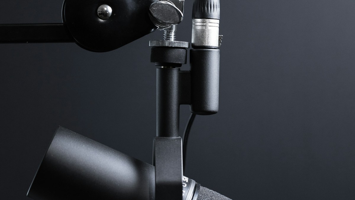 Studio microphone on a desk for freelance AI voiceover and text-to-speech work