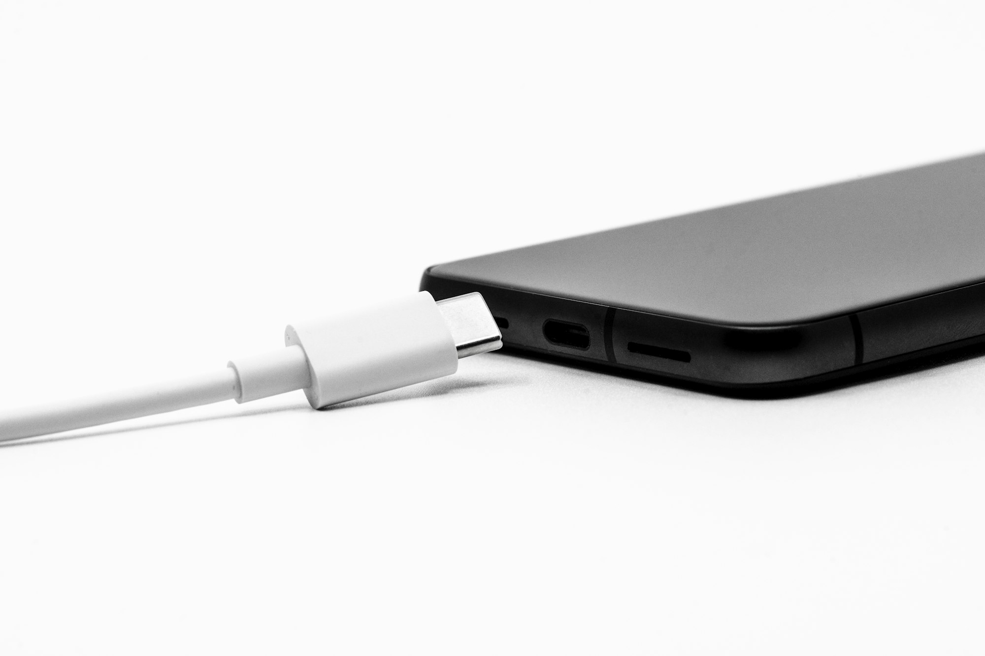 USB-C cable plugged into a laptop for fast charging