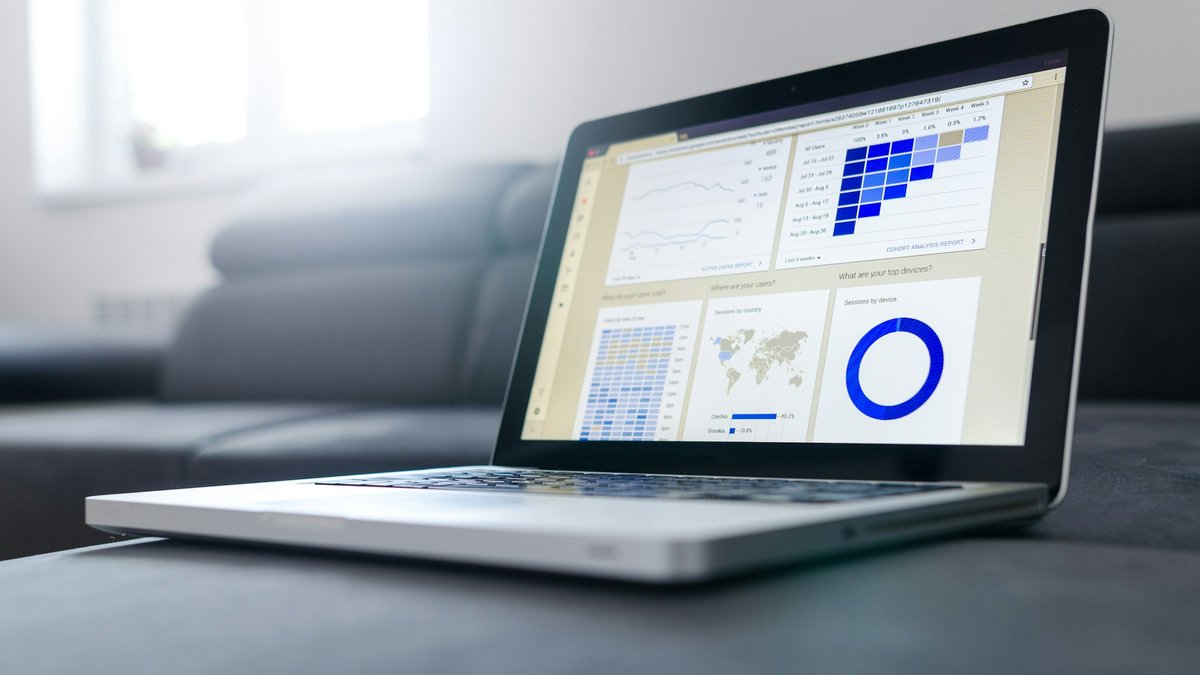 featured Laptop showing charts and dashboard visuals for a GPT-6 Intelligent UI freelancer try-or-dial-back decision
