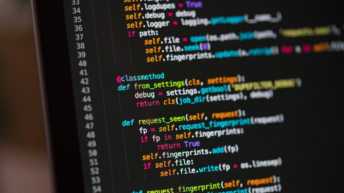 Close-up of Python code on a laptop screen for a JetBrains Air IDE try-or-skip decision